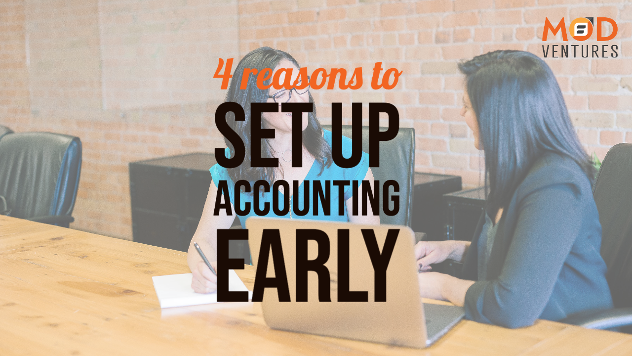 Two women sit at a conference table talking, with text overlay: "4 reasons to set up accounting early." The MOD Ventures LLC logo appears in the top right corner, highlighting the benefits of partnering with a Fractional CFO.