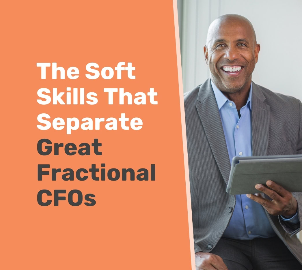 Smiling man in a suit holds a tablet, sitting next to text that reads, "The Soft Skills That Separate Great Fractional CFOs.